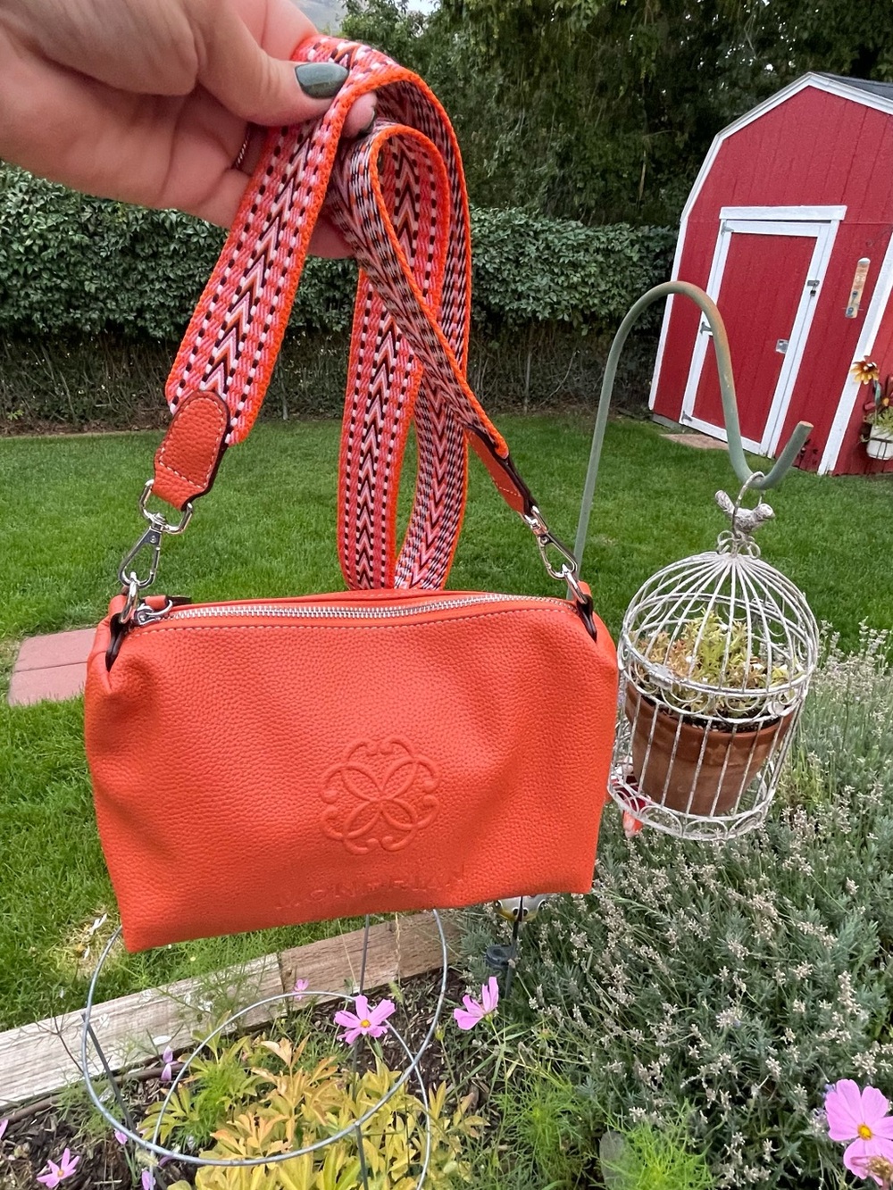 Textured Orange Crossbody Bag with Patterned Strap